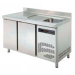 https://donbar.es/wp-content/uploads/2026/04/Mesa-Refrigerada-Acero-Inoxidable-con-Fregadero-2-Puertas-2-Estantes-250-Litros-Gama-600-1492x600x850h-mm-TRS-150F-EUTRON.jpg